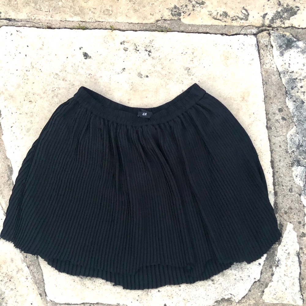 Mid rise black ruffle skirt.